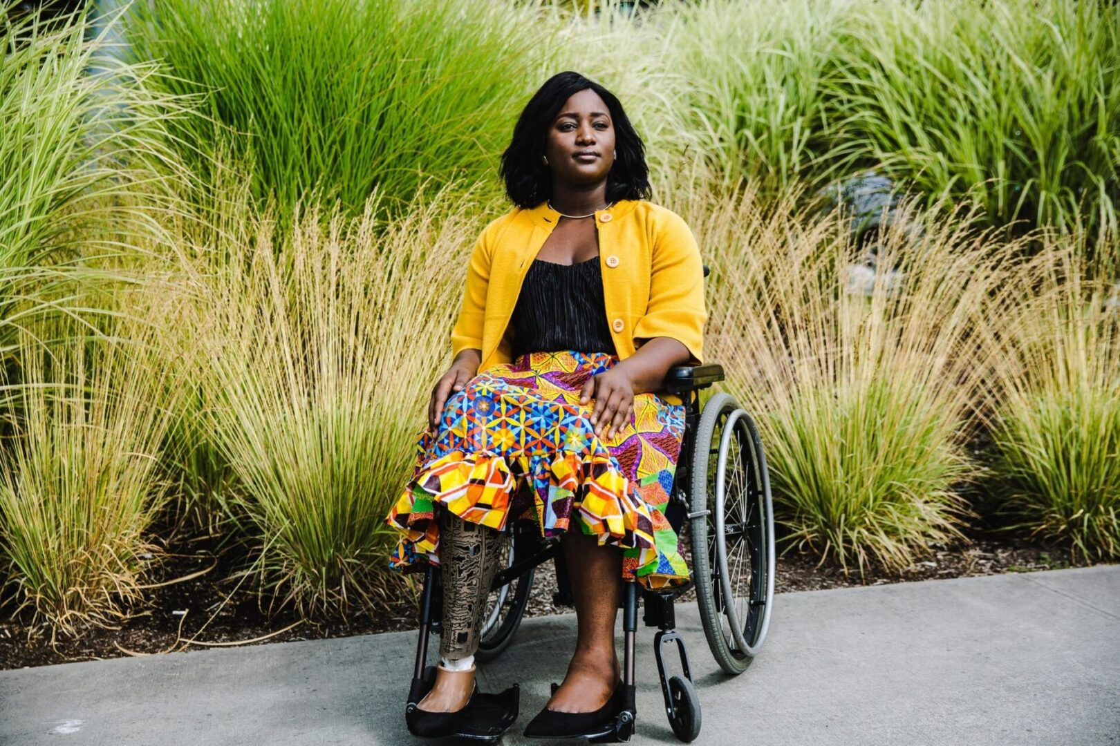 A woman in a wheelchair with her legs crossed.